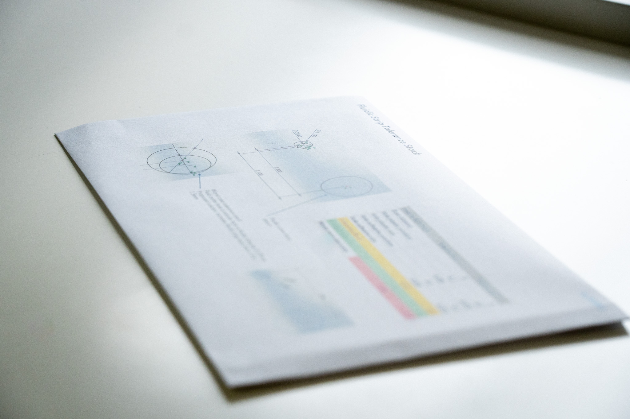 paperwork showing tolerance stack analysis - mechanical design support for wearable products